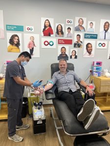 MP Mark Holland making a blood donation