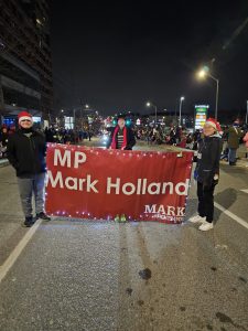 MP Mark Holland marching in Santa Claus Parade