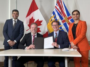 Minister Holland signs agreement with the Government of British Columbia