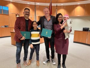 MP Mark Holland poses with new Canadian citizens in Ajax