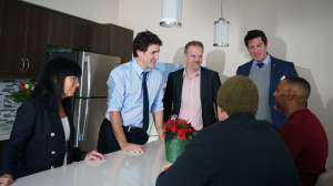 Prime Minister Justin Trudeau joins MP Mark Holland and others in a condo unit to have a discussion on affordable housing
